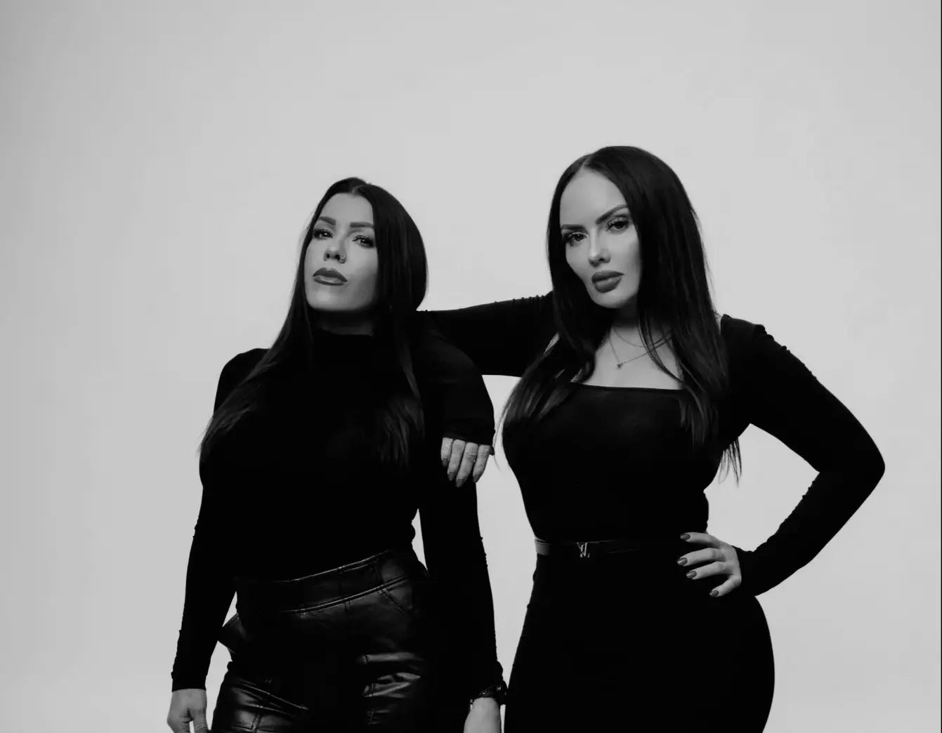 Owner Jaime and Melissa posing for a black and white photo.