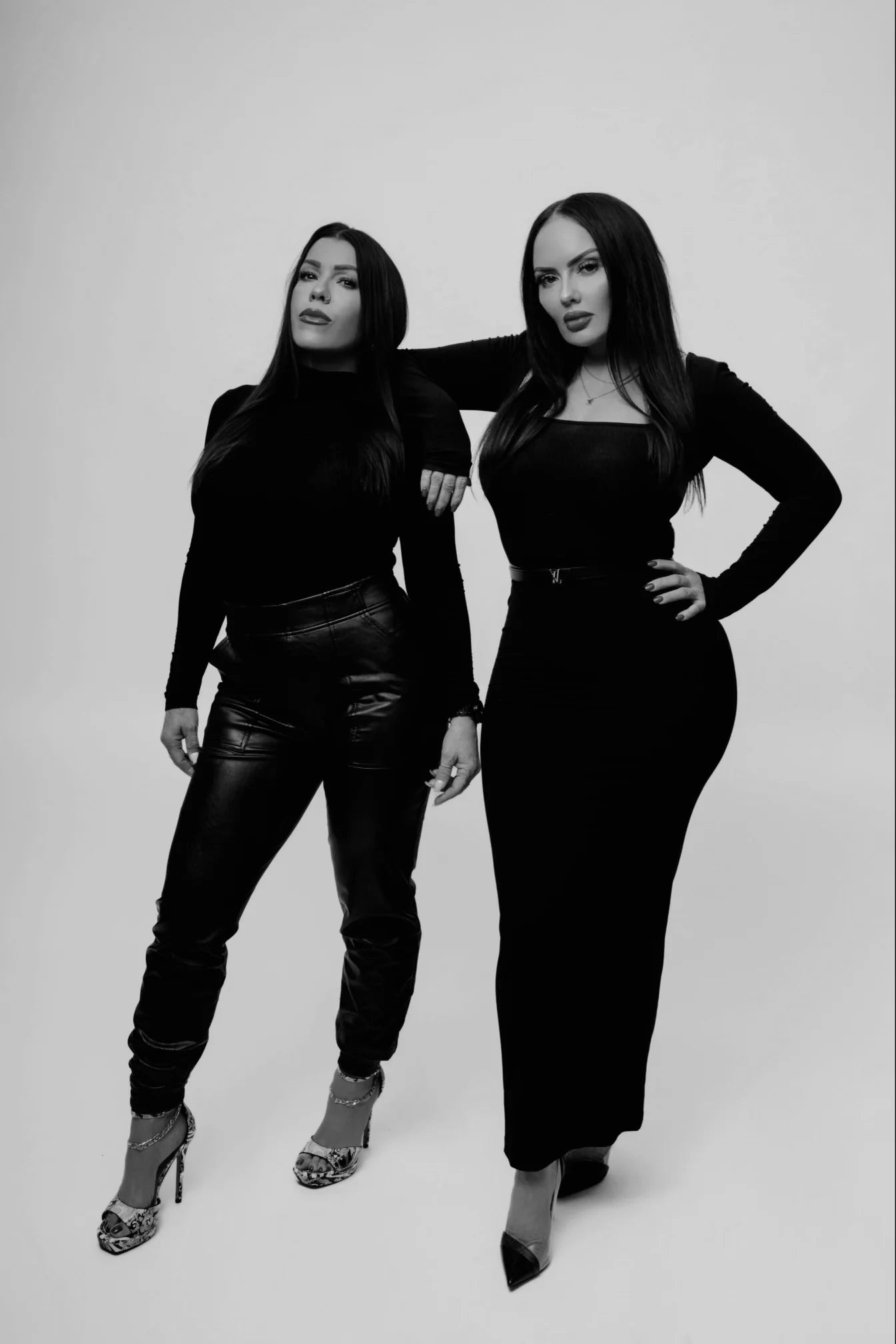 Owner Jaime and Melissa posing for a black and white photo.
