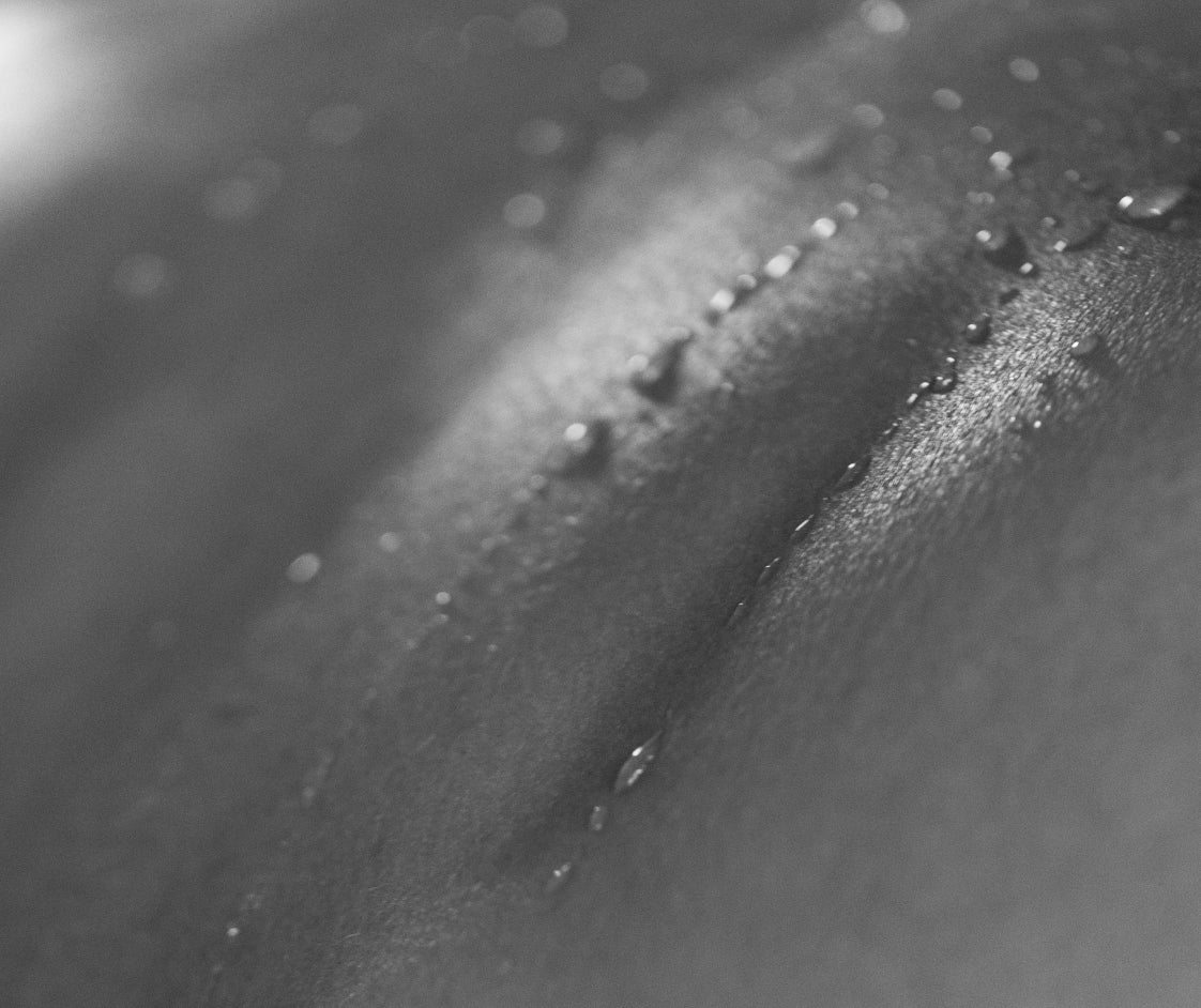 Close up of skin with water droplets sitting on it